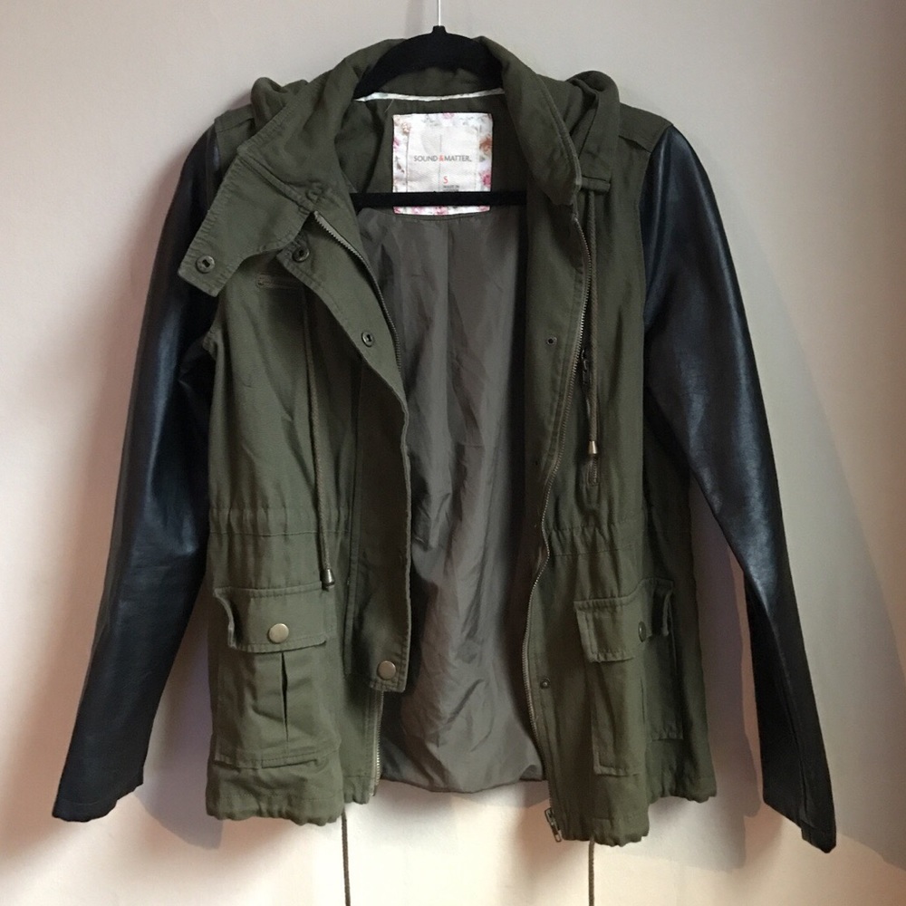 Olive green jacket with black leather sleeves.
